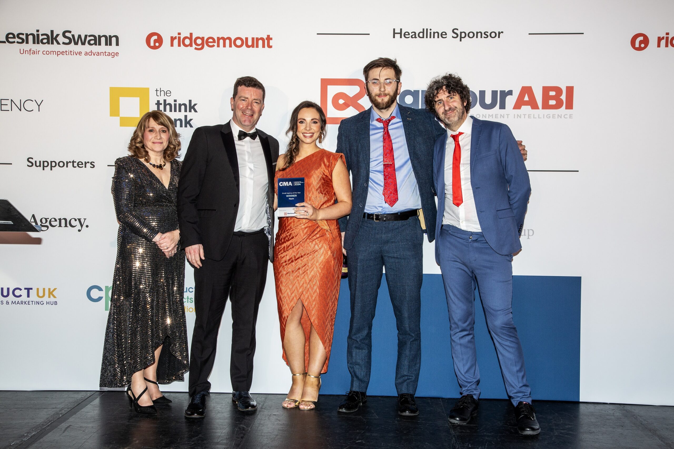 Ripple team accepting award at the Construction Marketing Awards